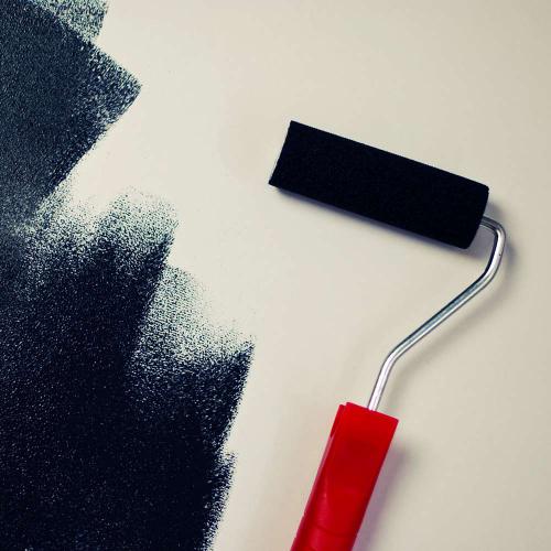 Roller putting paint on a wall - Airdrie Paint and Decor